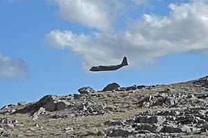 Plane roars just over the col