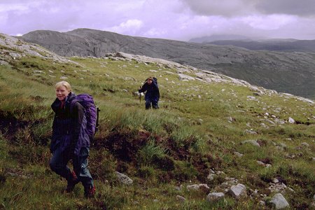 Climbing through rough heather.