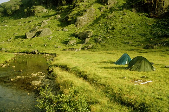 The tents pitched by the river in Gleann Mendall