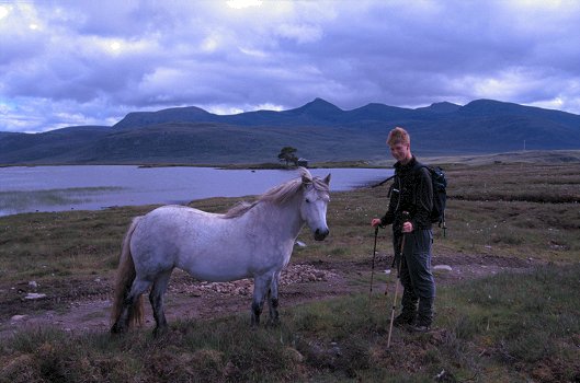Andrew making friends with one of the ponies above Home Loch