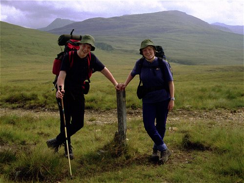 Susan and Andrew at the marker post for the path the shore on Loch an Daimh 