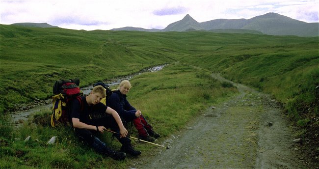 Two tired walkers - the target is the base of the pyramid peak