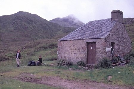 The small bothy and the summit cone of Stob Ban above