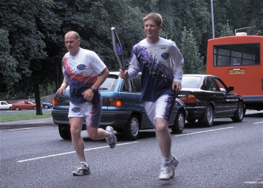 Andrew carrying the baton in Morpeth